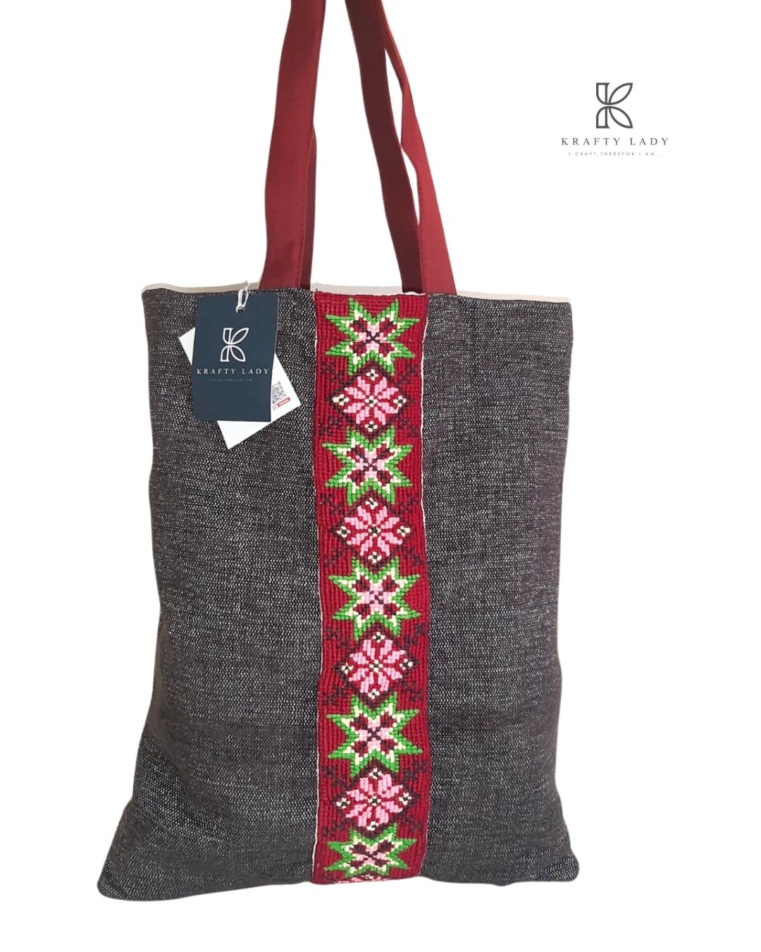 Dark Handwoven Tote Bag with Traditional Geometric Embroidery – Red & Green Accents