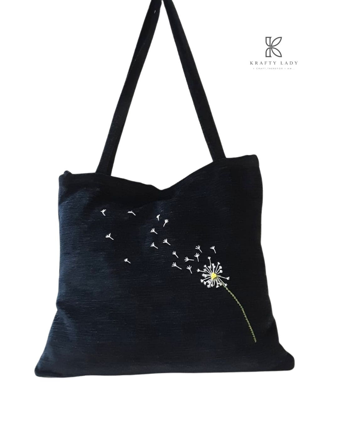 Black tote bag with dandelion design