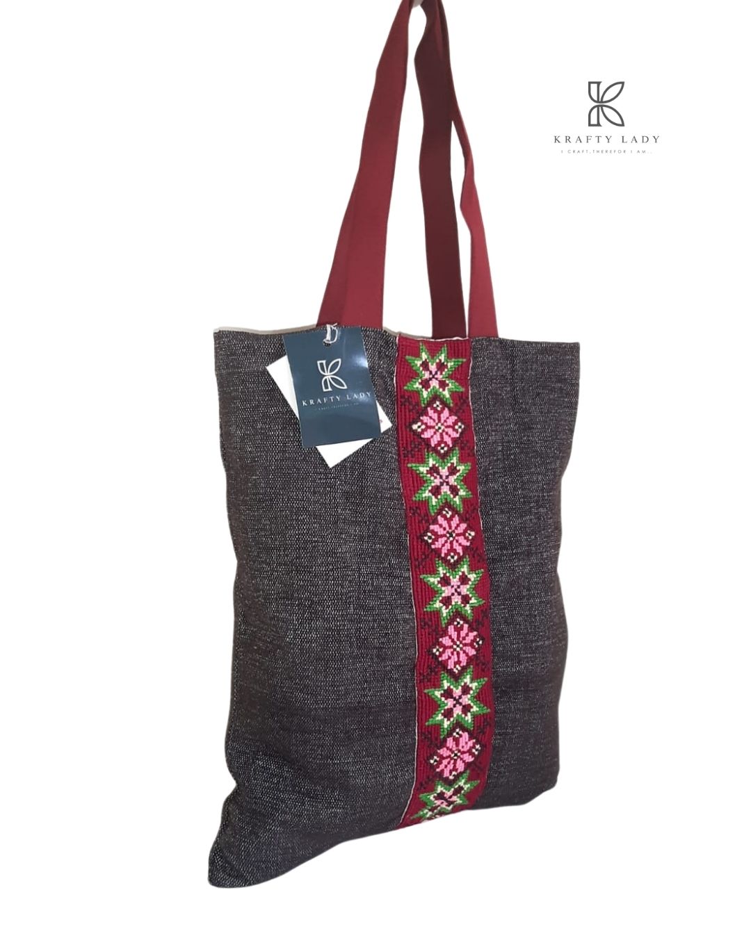 Dark Handwoven Tote Bag with Traditional Geometric Embroidery – Red & Green Accents