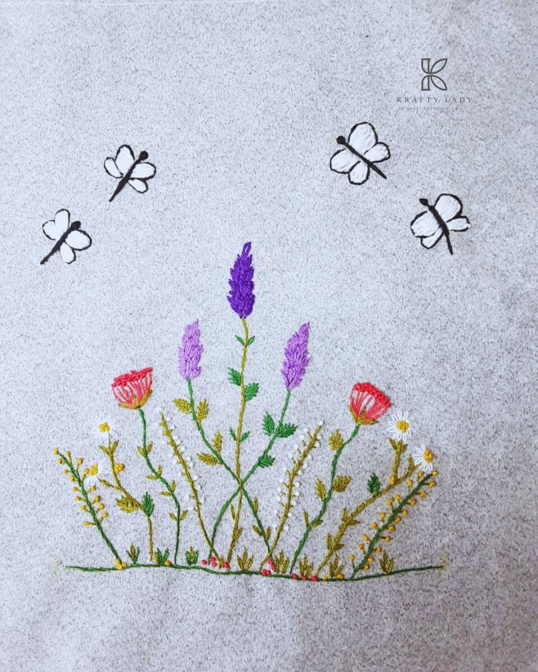 Gray tote bag with floral and insect embroidery