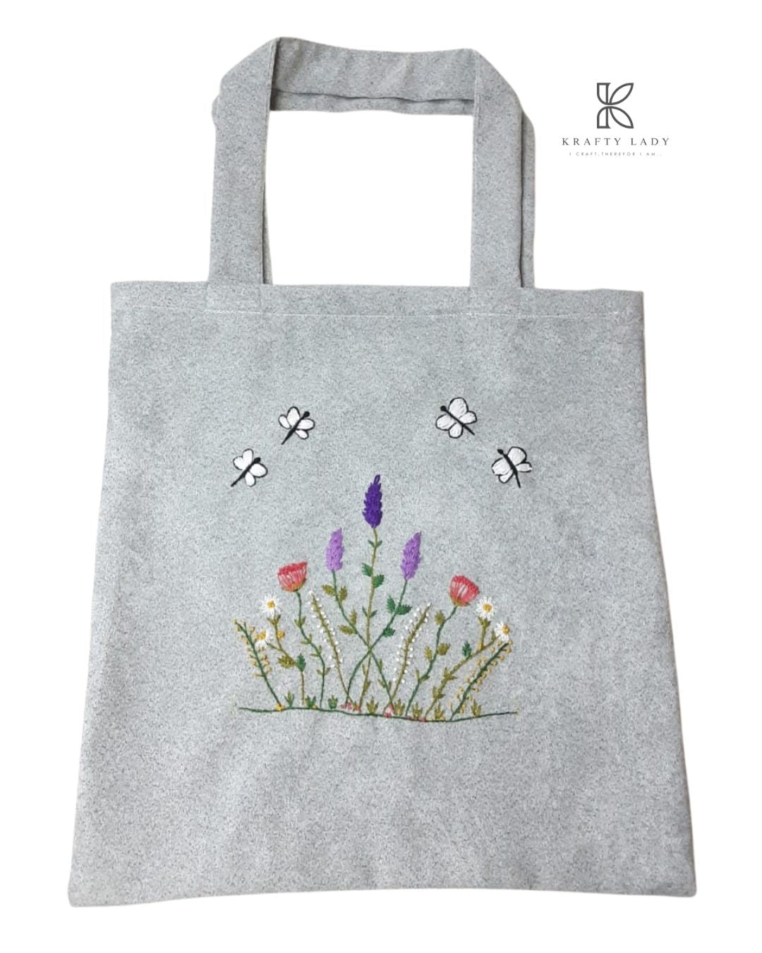 Gray tote bag with floral and insect embroidery